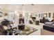 Spacious living room with carpet, multiple seating areas, and an eclectic style at 4276 S Tempe Ct, Aurora, CO 80018