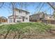 A large backyard with a patio, play structure, and plenty of grassy space at 4620 E 135Th Way, Thornton, CO 80241