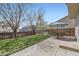 Spacious backyard featuring a well-manicured lawn and a shaded patio at 4620 E 135Th Way, Thornton, CO 80241