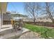 Backyard with lush lawn, a patio area with shade, and a well-maintained fence at 4620 E 135Th Way, Thornton, CO 80241
