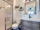 Updated bathroom with glass shower, vanity, and black fixtures at 4620 E 135Th Way, Thornton, CO 80241