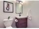 Well-lit half bathroom showcasing modern fixtures and a dark wood vanity at 4620 E 135Th Way, Thornton, CO 80241