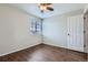 Bedroom featuring a window, and wood floors at 4620 E 135Th Way, Thornton, CO 80241