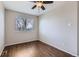 Unfurnished bedroom with ceiling fan and wood floor at 4620 E 135Th Way, Thornton, CO 80241