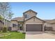 Charming two-story home with a two car garage, a well-manicured lawn, and mature trees at 4620 E 135Th Way, Thornton, CO 80241