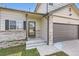 Charming home with a well-kept lawn, brick accents, and an attached garage at 4620 E 135Th Way, Thornton, CO 80241