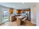 Well-lit kitchen featuring granite countertops, stainless steel appliances, and a center island at 4620 E 135Th Way, Thornton, CO 80241