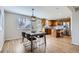 Spacious open concept kitchen and dining area with modern appliances and wooden cabinetry at 4620 E 135Th Way, Thornton, CO 80241