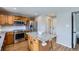 Updated kitchen featuring stainless appliances, a large island, and wood cabinets at 4620 E 135Th Way, Thornton, CO 80241