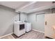 Laundry room with washer, dryer, and storage for household tasks at 4620 E 135Th Way, Thornton, CO 80241