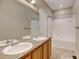 Bathroom with double vanity, tub, and shower at 9343 Amison Cir # 103, Parker, CO 80134