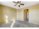 Bedroom with ceiling fan and access to bathroom at 9343 Amison Cir # 103, Parker, CO 80134