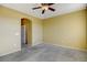 Bedroom with ceiling fan and access to bathroom at 9343 Amison Cir # 103, Parker, CO 80134