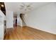 Living room with hardwood floors, fireplace, and staircase at 9343 Amison Cir # 103, Parker, CO 80134