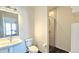 Bathroom featuring shower with glass door, vanity with vessel sink and tile floor at 410 Acoma St # 605, Denver, CO 80204