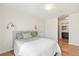 Cozy bedroom with hardwood floors, ensuite bath access and ample natural light at 410 Acoma St # 605, Denver, CO 80204