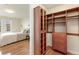 Bedroom features a closet with custom storage solutions and view of the bed at 410 Acoma St # 605, Denver, CO 80204