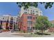 Watermark building, featuring a classic brick facade and landscaping at 410 Acoma St # 605, Denver, CO 80204