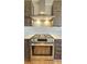 Gourmet kitchen featuring stainless steel range hood, oven, and cabinetry at 410 Acoma St # 605, Denver, CO 80204