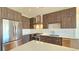 Modern kitchen with stainless steel appliances and center island at 410 Acoma St # 605, Denver, CO 80204