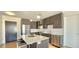 Stylish kitchen featuring stainless steel appliances and a spacious island at 410 Acoma St # 605, Denver, CO 80204