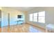 Bright living room boasts hardwood floors, large windows, and sleek console table at 410 Acoma St # 605, Denver, CO 80204