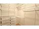 Spacious walk-in closet featuring built-in shelving and storage baskets at 410 Acoma St # 605, Denver, CO 80204