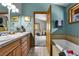 Well-appointed bathroom featuring double sinks, a soaking tub, and modern fixtures, creating a spa-like retreat at 5254 Cheyenne Rd, Indian Hills, CO 80454