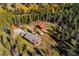 Scenic aerial view of a home surrounded by lush foliage, showcasing its tranquil setting at 28553 Birch Ln, Conifer, CO 80433