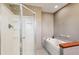 Bright bathroom featuring a glass shower and a relaxing jacuzzi bathtub at 28553 Birch Ln, Conifer, CO 80433