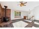 Cozy living room featuring a brick fireplace and a built-in window bench for relaxing and reading at 28553 Birch Ln, Conifer, CO 80433