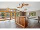 Cozy living room featuring a unique wood chandelier, wood burning stove and expansive views at 28553 Birch Ln, Conifer, CO 80433