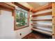 Pantry with wooden shelves and a window providing natural light at 28553 Birch Ln, Conifer, CO 80433