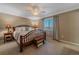 Spacious main bedroom with a large window and ceiling fan at 2776 Savage Rd, Elizabeth, CO 80107