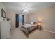 Cozy bedroom with a metal bed frame and ceiling fan at 2776 Savage Rd, Elizabeth, CO 80107