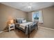 Guest bedroom with a full-size bed and ceiling fan at 2776 Savage Rd, Elizabeth, CO 80107