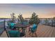 Deck with table and chairs offering scenic views at 2776 Savage Rd, Elizabeth, CO 80107