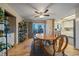 Dining room featuring hardwood floors, wood table, and sliding door to deck at 2776 Savage Rd, Elizabeth, CO 80107