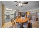 Dining area with wood table and chairs, open to kitchen at 2776 Savage Rd, Elizabeth, CO 80107