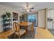 Bright dining room with wood table and access to deck at 2776 Savage Rd, Elizabeth, CO 80107