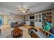 Living room with hardwood floors, fireplace, and built-in bookcases at 2776 Savage Rd, Elizabeth, CO 80107