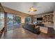 Gathering room with built-in bookshelves and sliding glass doors at 2776 Savage Rd, Elizabeth, CO 80107