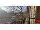 A cozy balcony offers a view of the neighborhood with mountain background at 7355 S Alkire St # 203, Littleton, CO 80127