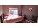 Bedroom with window and bed featuring sunlight streaming through the blinds at 7355 S Alkire St # 203, Littleton, CO 80127