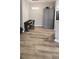 Neutral dining area featuring a piano, gray cabinets, and wood flooring at 7355 S Alkire St # 203, Littleton, CO 80127