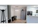 This dining area displays a piano, gray storage cabinet, and modern pendant lighting at 7355 S Alkire St # 203, Littleton, CO 80127