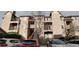 Exterior view of condo building with stone facade and balconies at 7355 S Alkire St # 203, Littleton, CO 80127