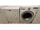 Laundry room features a white washing machine and a white dryer at 7355 S Alkire St # 203, Littleton, CO 80127
