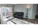 A living room with a balcony and modern flooring at 7355 S Alkire St # 203, Littleton, CO 80127
