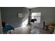 Office with a gray accent wall, a window, and a desk with computer monitors at 7355 S Alkire St # 203, Littleton, CO 80127